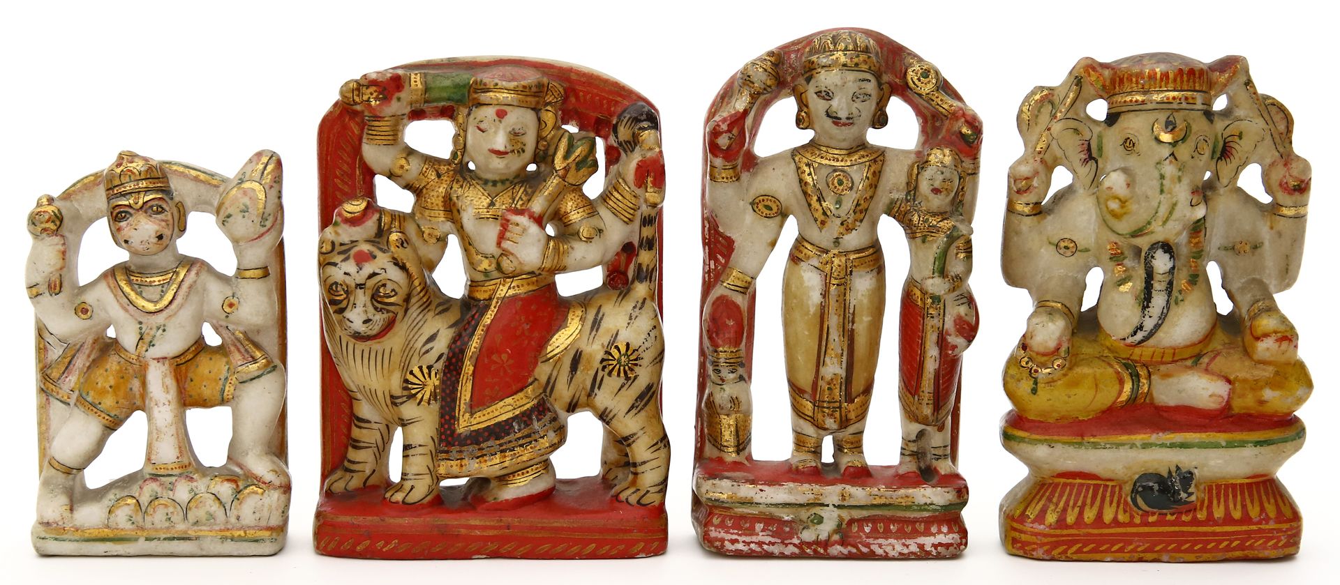 Vier Skulpturen hinduistischer Gottheiten.