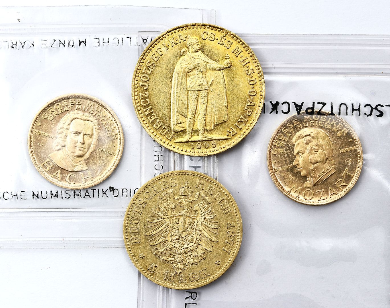 Vier Goldmünzen/-medaillen: 10 Krona, Ungarn 1909 - 5 Mark, Preußen 1877 B - 2x "Grosse Musiker - Bach und Mozart".