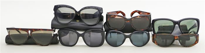 Sieben Designer-Sonnenbrillen.