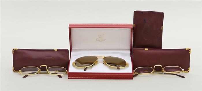 Zwei Lesebrillen und Sonnenbrille, Cartier.