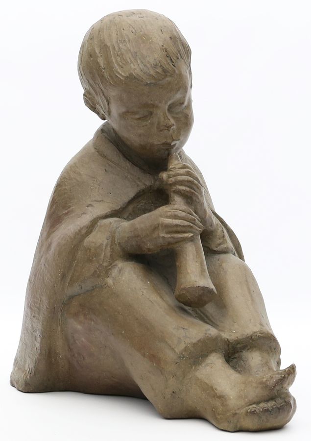 Skulptur "Junge mit Flöte".