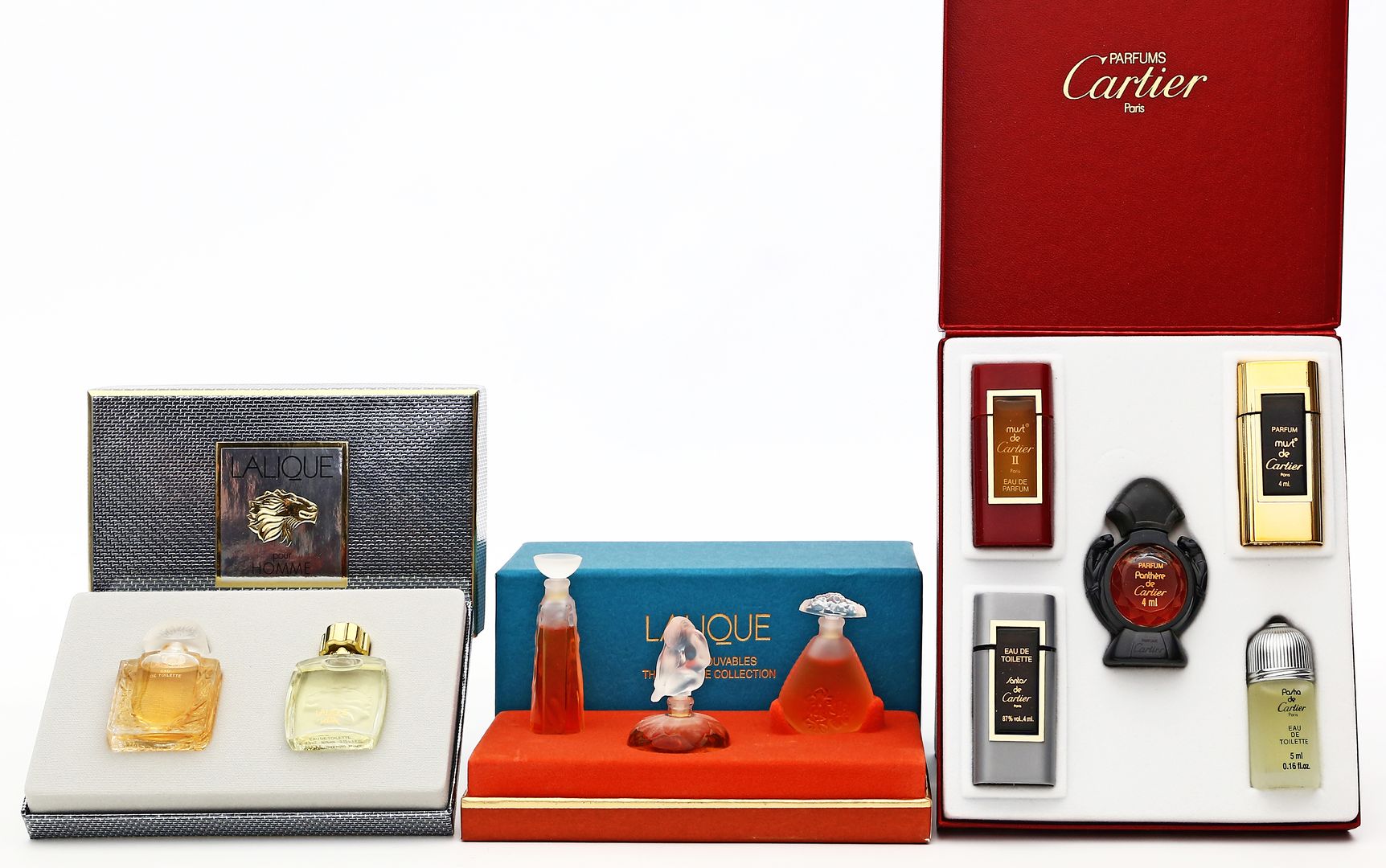 3 Parfum-Miniaturen-Sets, Lalique und Cartier.